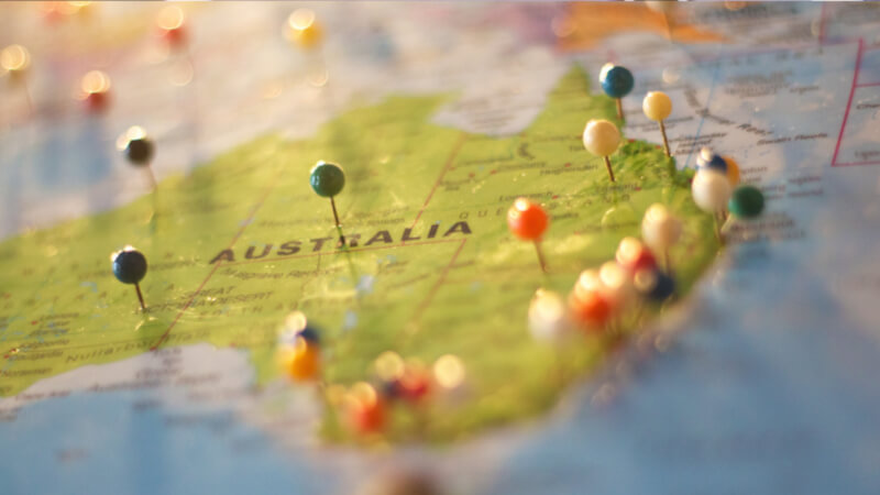 pushpins in a globe on Australia